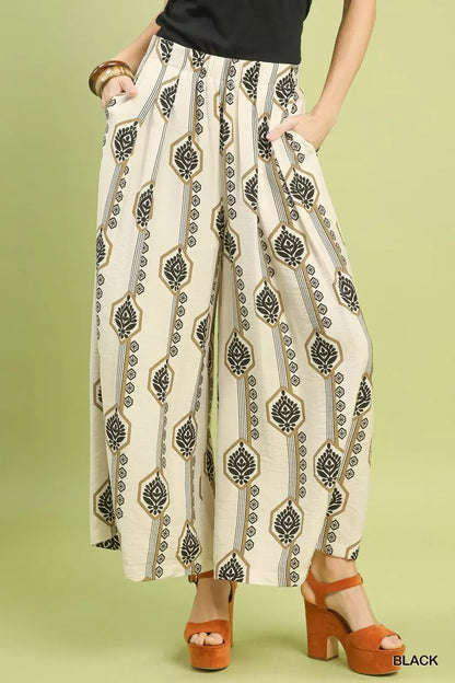 Black Umgee geometric boho print wide-leg pants with a relaxed fit, featuring bold patterns and a comfortable, flowing silhouette.