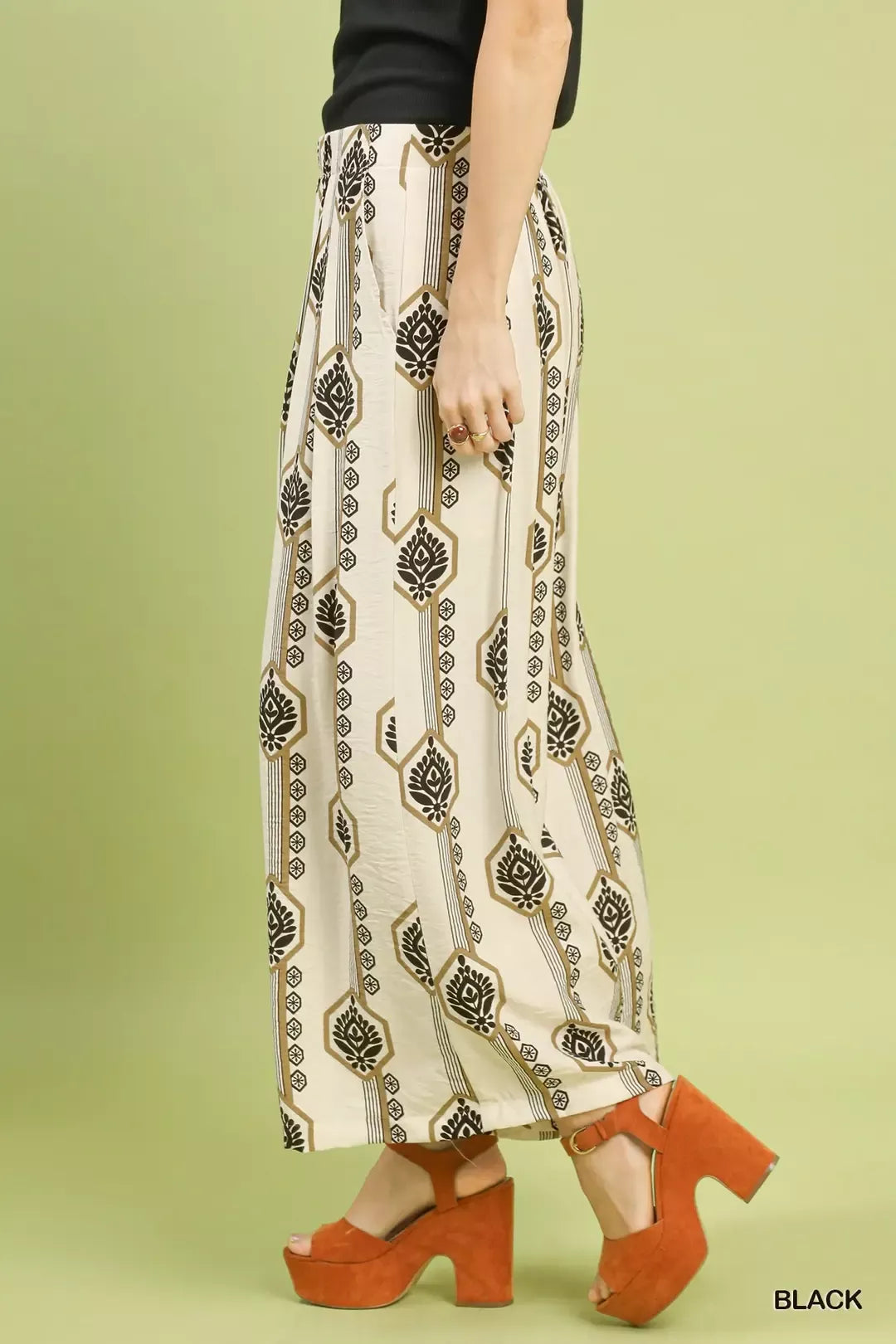 Black Umgee geometric boho print wide-leg pants with a relaxed fit, featuring bold patterns and comfortable waistband.