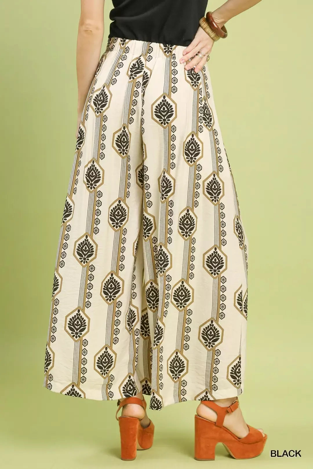 Black Umgee boho print wide-leg pants with geometric pattern, featuring a relaxed fit and flowing fabric.