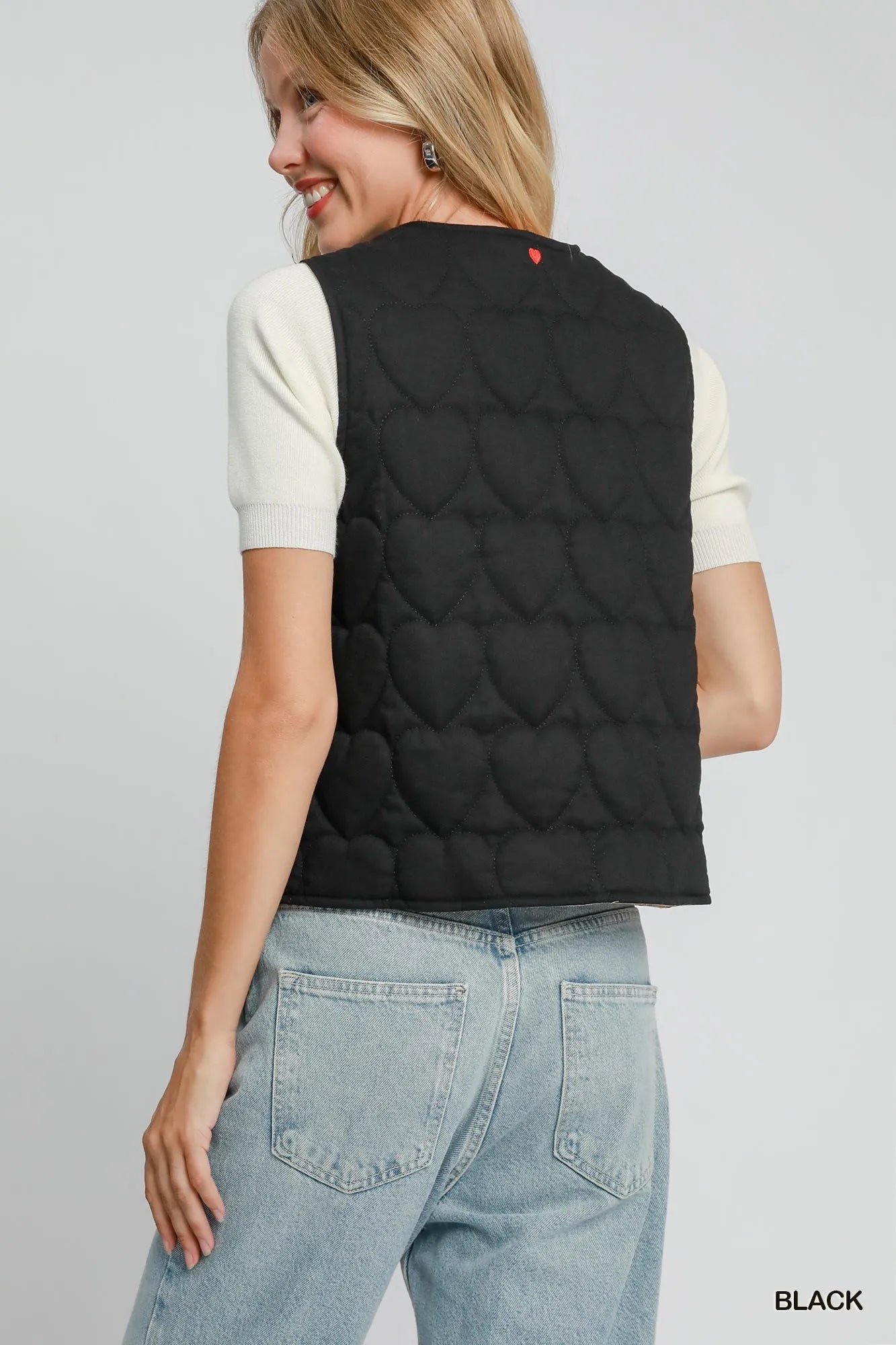 Black Umgee Heart Quilted Tie-Front Vest featuring a stylish quilted pattern and a front tie closure.