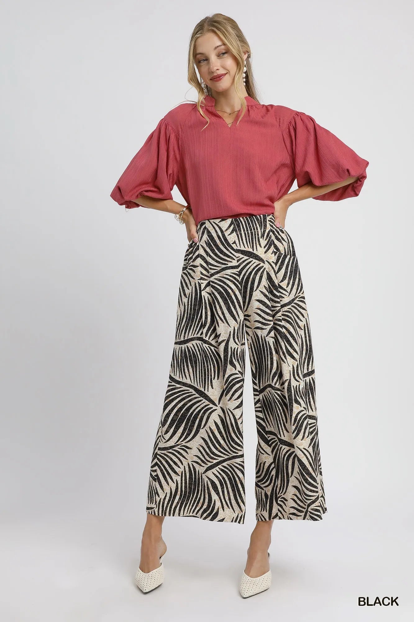 Black Umgee palm leaf print wide-leg culotte pants with relaxed fit and stylish design, perfect for casual and summer outfits.