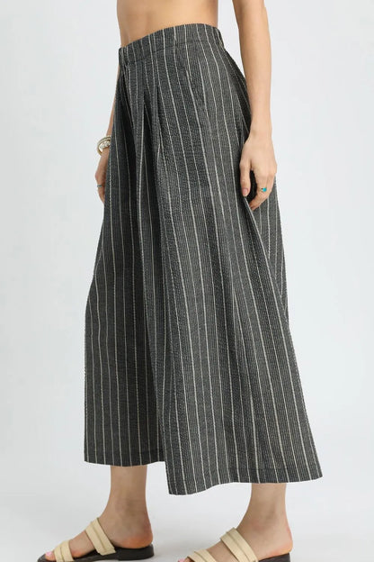 Black Umgee pinstripe crop palazzo pants with wide legs and high waist, shown on a model. Trendy and comfortable fashion choice.