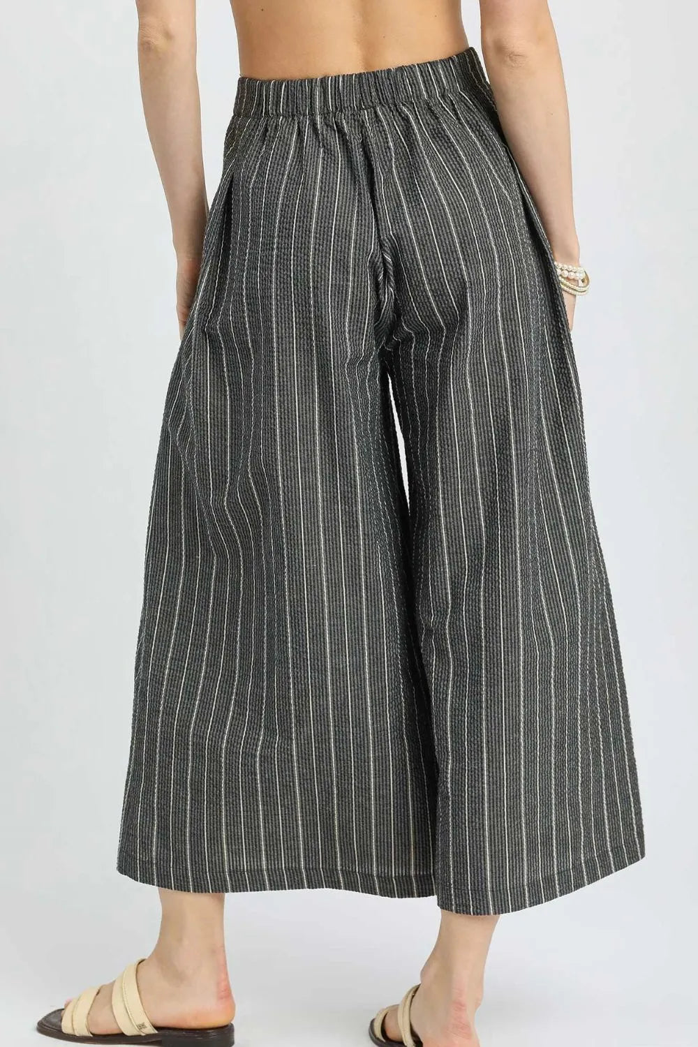 Black Umgee pinstripe crop palazzo pants with wide legs and high waist, stylish and comfortable for casual or office wear.