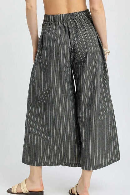 Black Umgee pinstripe crop palazzo pants with wide legs and high waist, stylish and comfortable for casual or office wear.