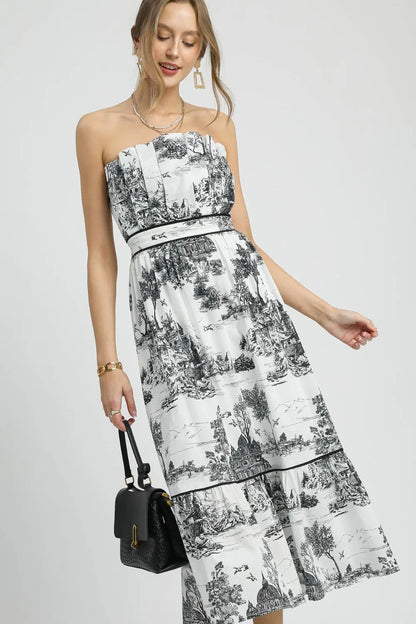 Black Umgee printed tiered tube midi dress with a sleeveless design and tiered skirt, perfect for casual or semi-formal wear.