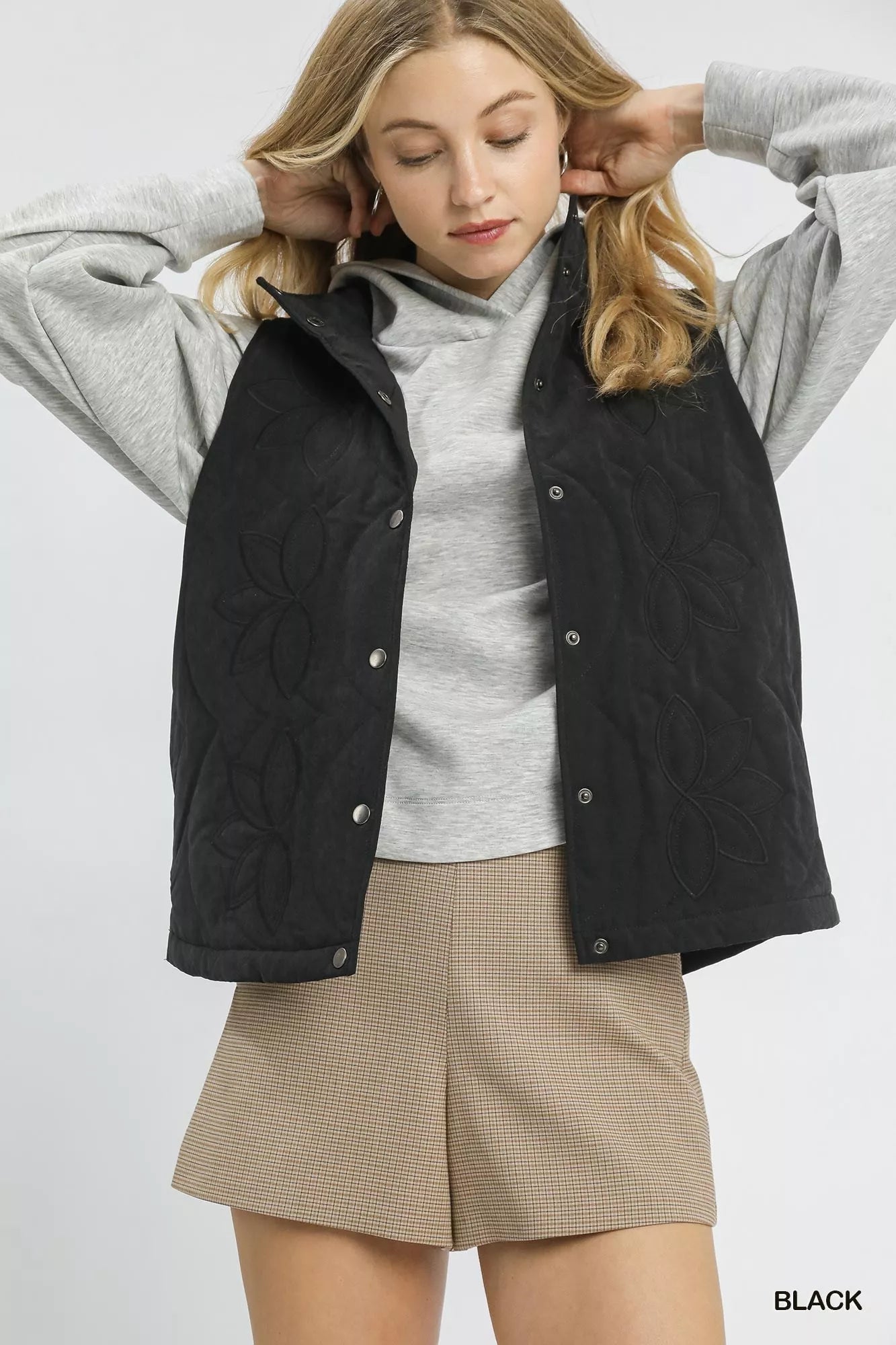 Black Umgee quilted embroidered vest with intricate embroidery and a stylish, cozy design, perfect for layered outfits.
