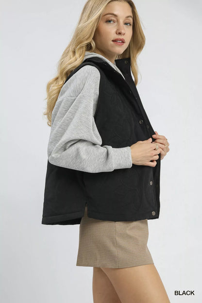 Black Umgee quilted embroidered vest with intricate stitching and a stylish collar, perfect for layering.