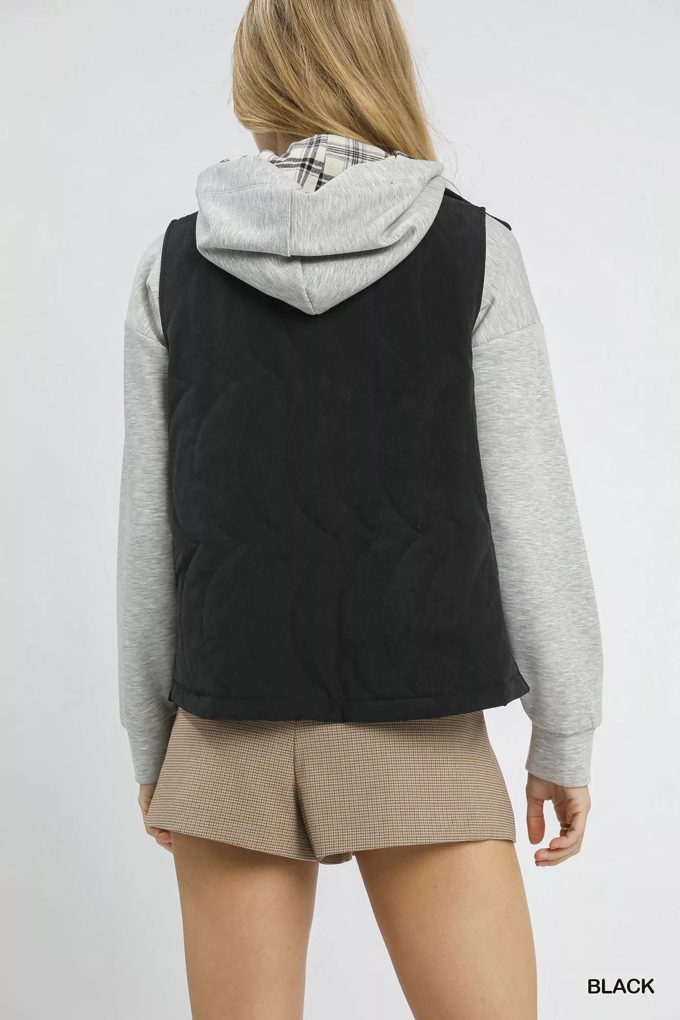 Black Umgee quilted embroidered vest with detailed stitching, featuring a stylish and comfortable design.