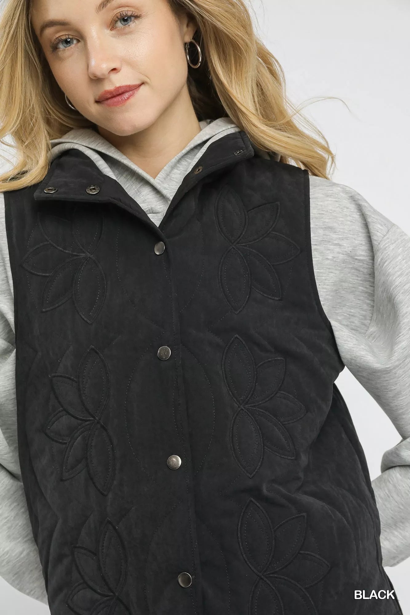 Black Umgee quilted embroidered vest with intricate stitching, lightweight design, and stylish details perfect for layered outfits.