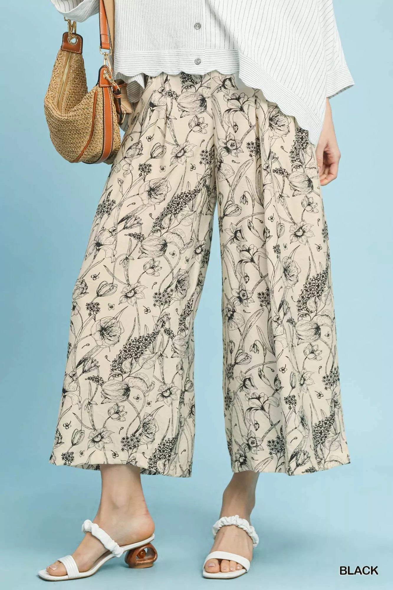 Black Umgee two-tone floral print pants with a relaxed fit, featuring a stylish and comfortable design for casual wear.