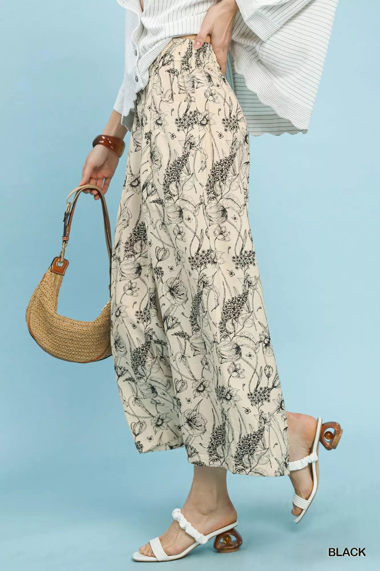 Black Umgee two-tone floral print pants with a relaxed fit, featuring a stylish and comfortable design by Trendsi.