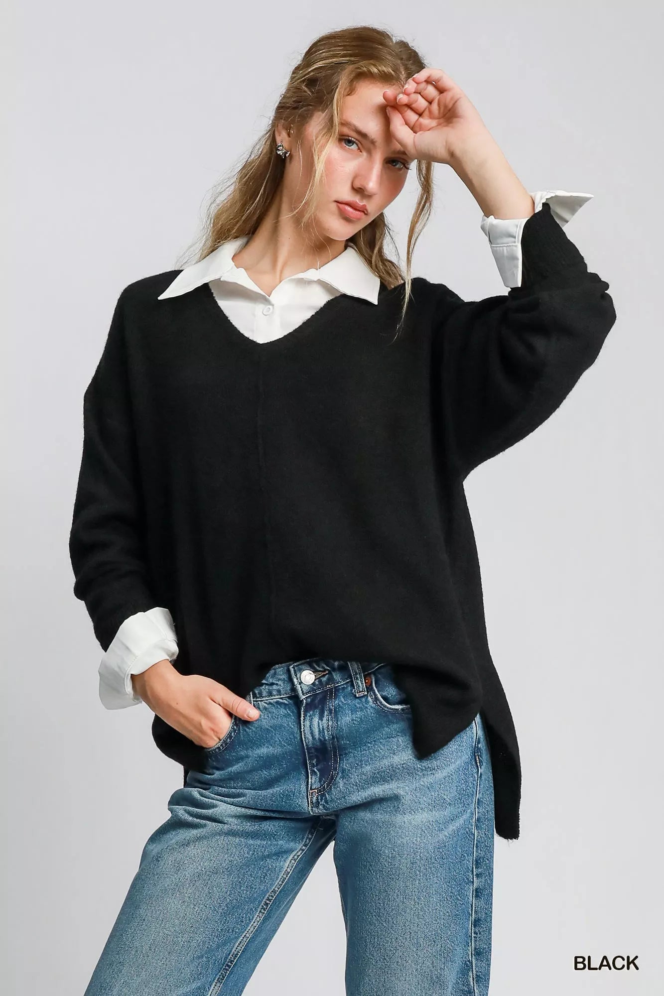 Black Umgee wool-blended pullover sweater, cozy and stylish, shown on a mannequin with long sleeves and a relaxed fit.