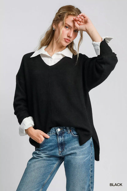 Black Umgee wool-blended pullover sweater, cozy and stylish, shown on a mannequin with long sleeves and a relaxed fit.