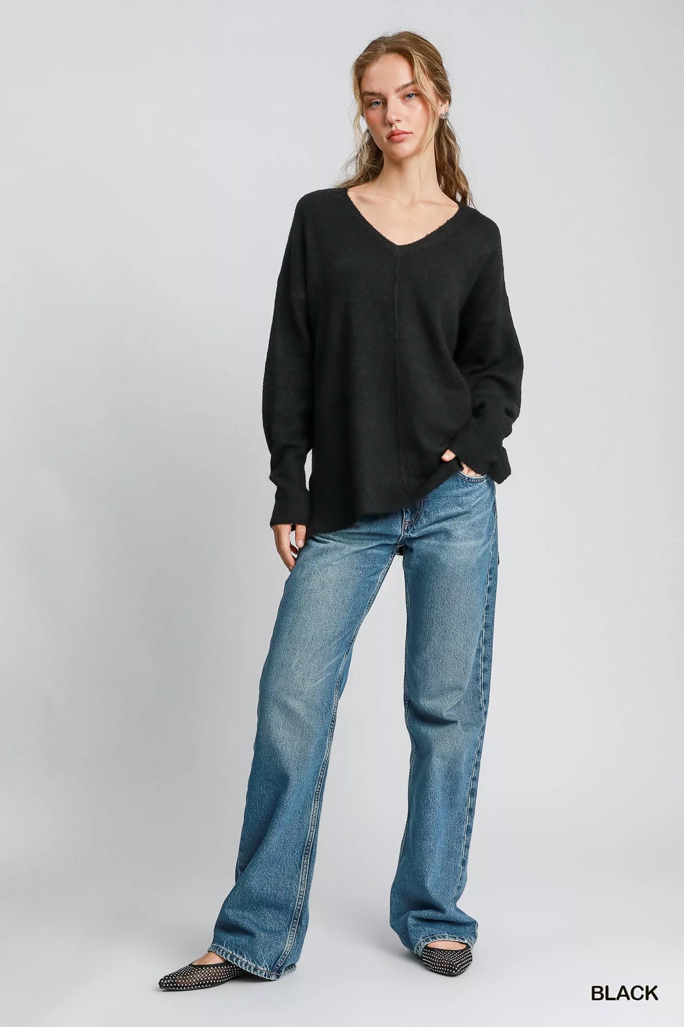 Black Umgee wool blended pullover sweater with a relaxed fit, showcased on a neutral background.