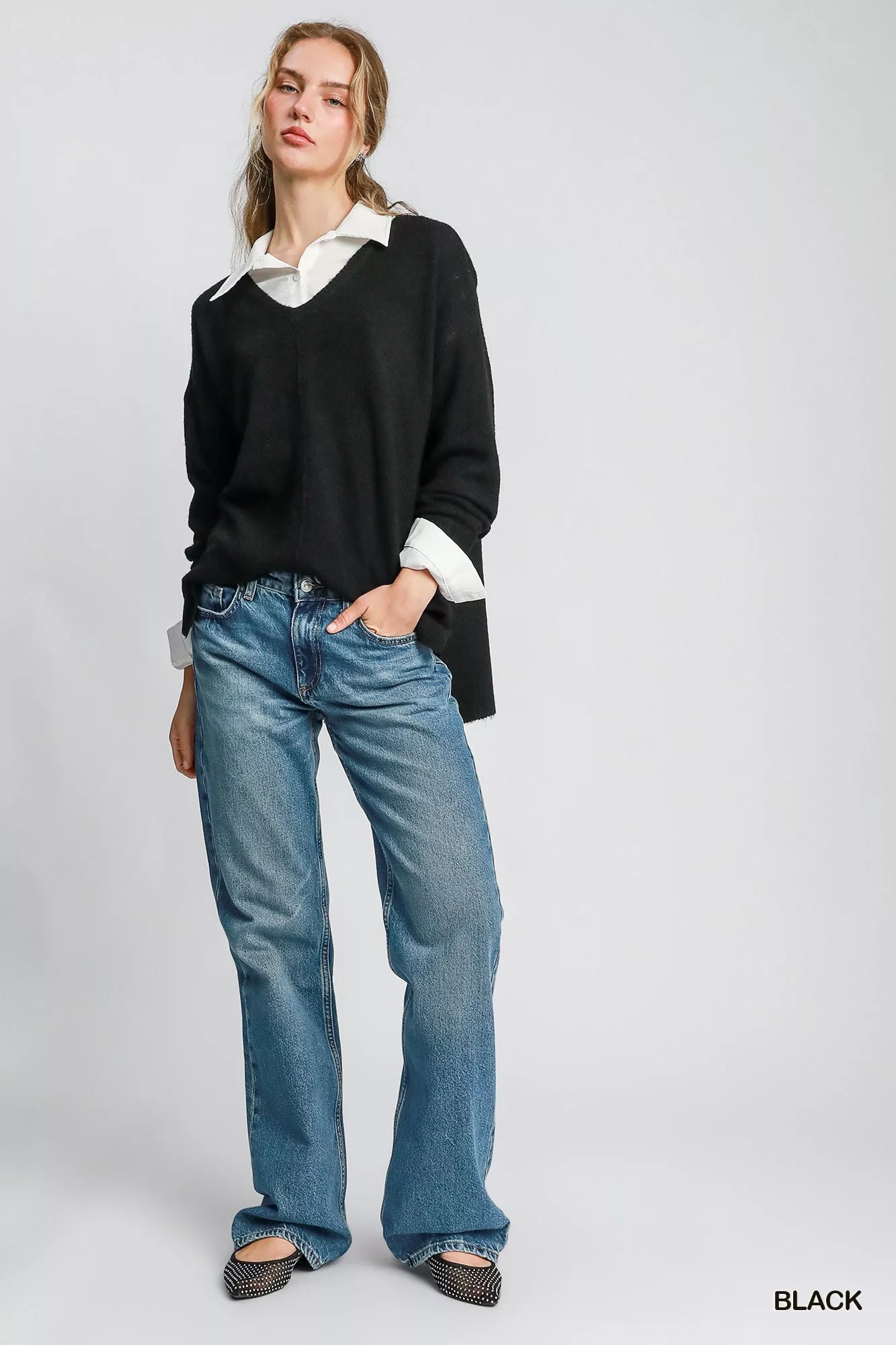 Black Umgee wool-blended pullover sweater from Trendsi, featuring a cozy, relaxed fit and ribbed cuffs and hem.