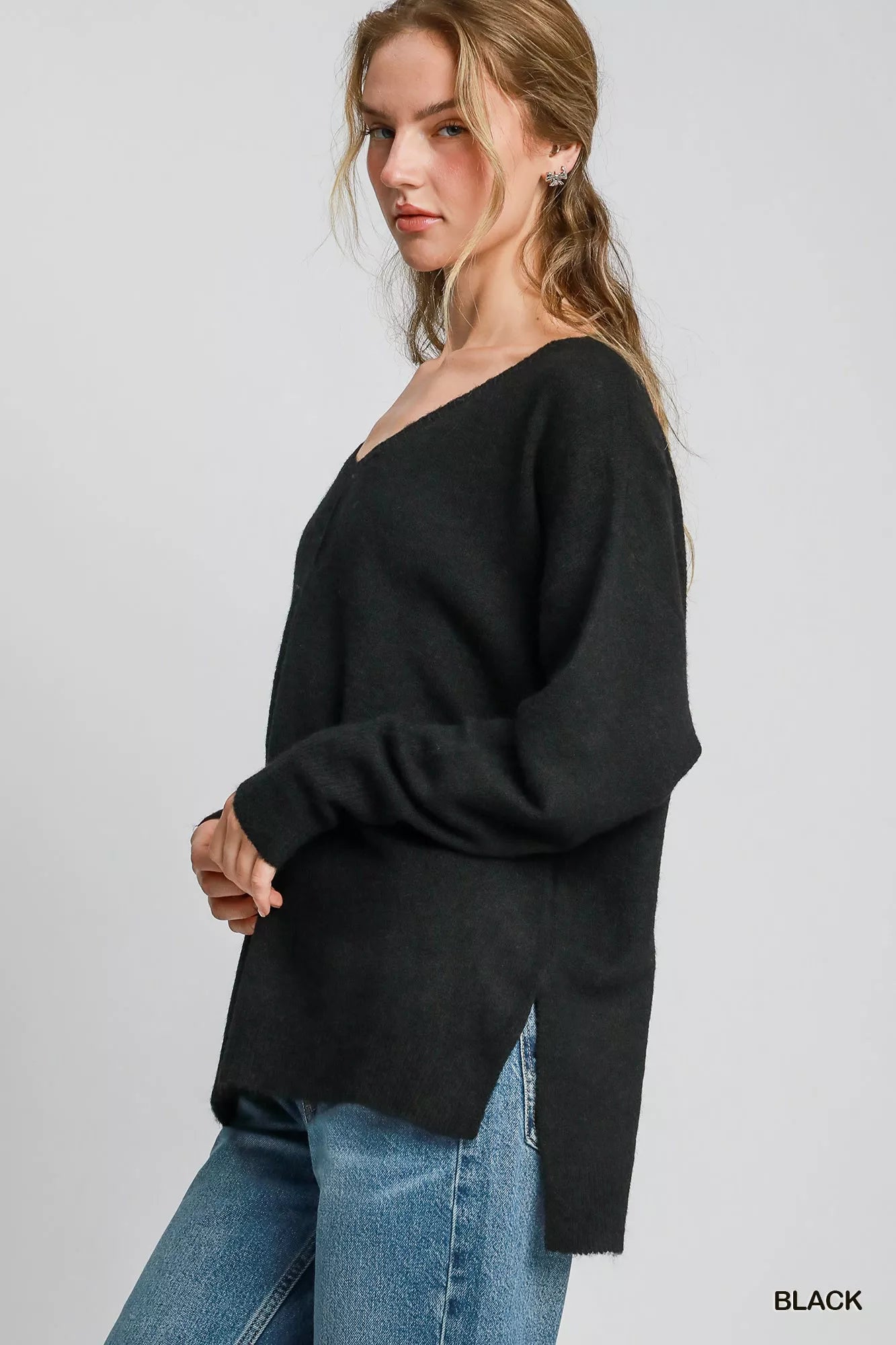 Black Umgee wool-blended pullover sweater from Trendsi, featuring a cozy, relaxed fit with long sleeves and a classic round neckline.