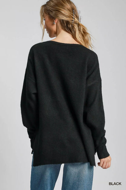 Black Umgee wool-blended pullover sweater with a cozy fit, featuring a round neckline and long sleeves.