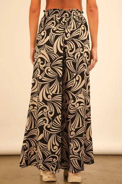 Plus size black printed wide leg pants from Very J by Trendsi, full-length with bold pattern and comfortable fit.
