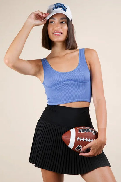 Black Very J pleated activewear skirt with built-in shorts for comfortable workout and casual wear.
