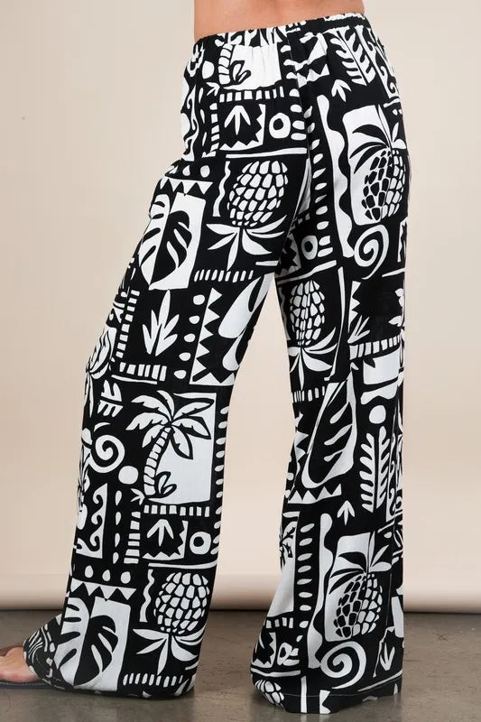 Black Very J printed casual wide-leg resort pants by Trendsi, featuring a relaxed fit and stylish pattern.