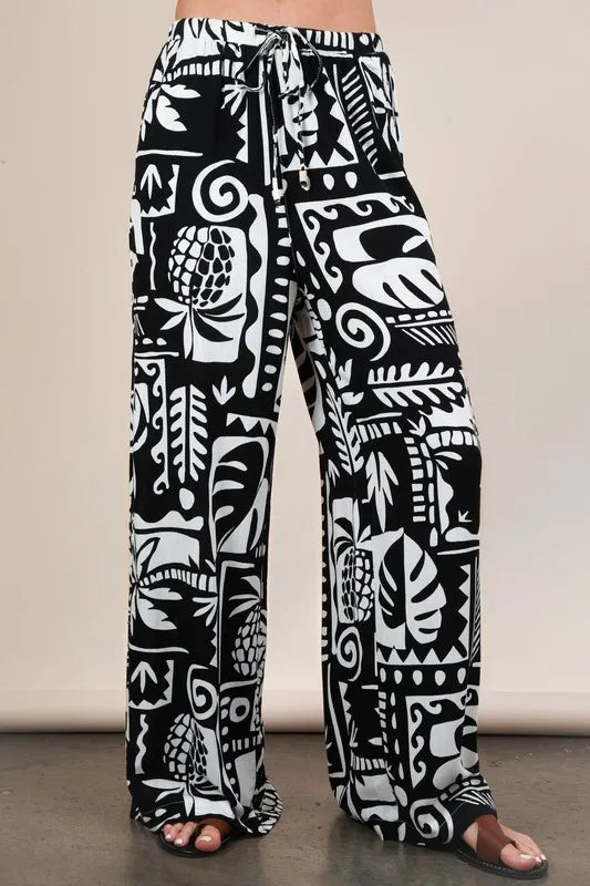 Black Very J printed casual wide-leg resort pants by Trendsi, featuring a relaxed fit and stylish design perfect for warm weather.