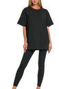 Black Zenana cotton round neck top and matching leggings set, casual loungewear from Trendsi.