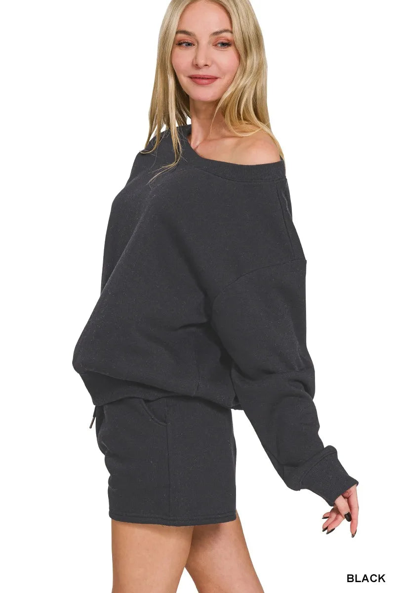 Black Zenana fleece sweatshirt and shorts set by Trendsi, featuring a boat neck design and cozy casual style.