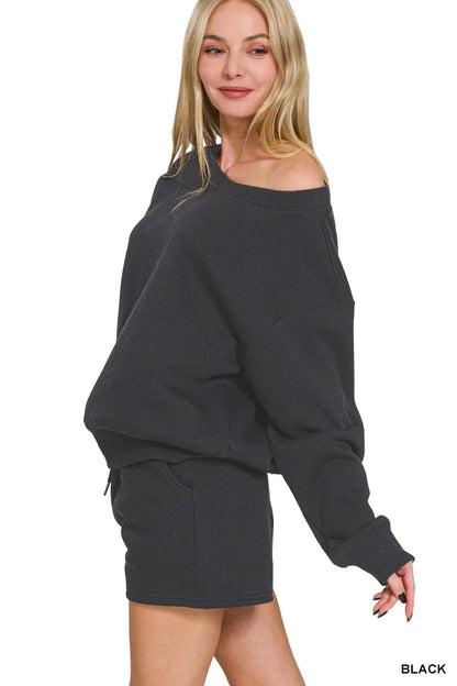 Black Zenana fleece sweatshirt and shorts set by Trendsi, featuring a boat neck design and cozy casual style.