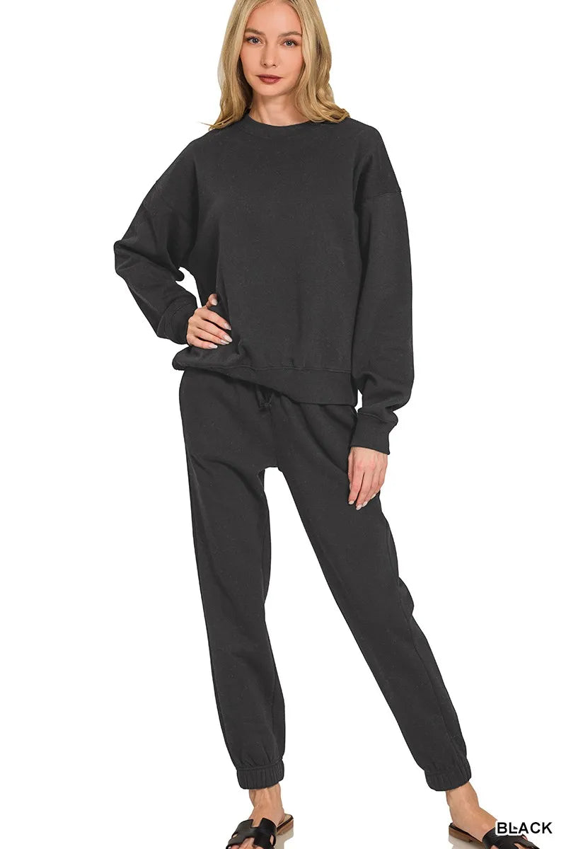 Black Zenana fleece long sleeve pullover and jogger set, cozy loungewear with ribbed cuffs and relaxed fit, casual and comfortable.