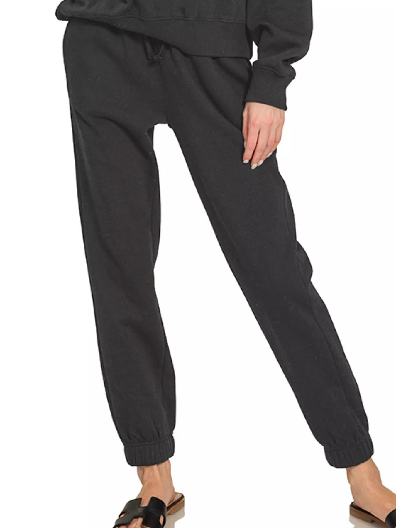 Black Zenana fleece long sleeve pullover and jogger set by Trendsi, featuring a cozy, casual loungewear look.