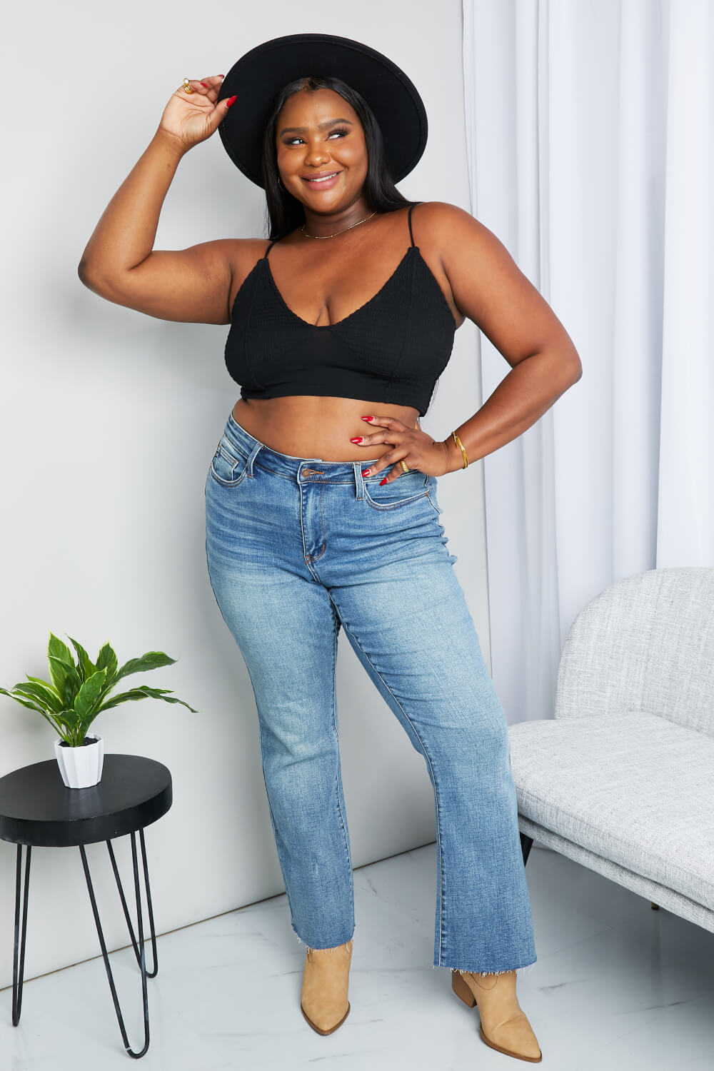 Black Zenana full-size textured spaghetti strap bralette with soft fabric and adjustable straps, displayed on a white background.