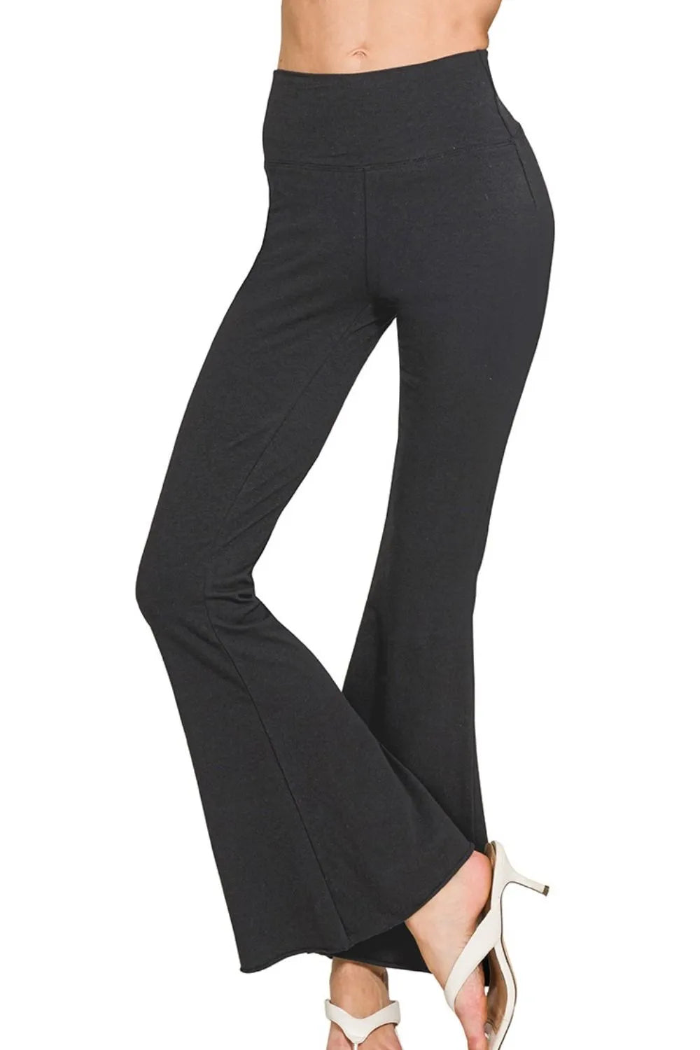 Black Zenana Raw Edge Hem Flare Yoga Pants by Trendsi featuring a relaxed fit and stylish raw edge hem detail.