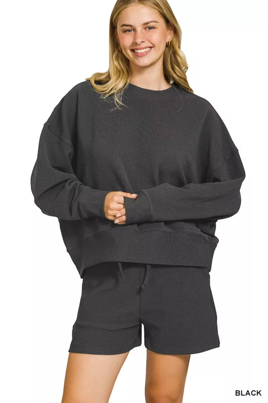 Black Zenana ribbed round neck pullover and shorts set with long sleeves and comfortable fit, perfect for casual wear.
