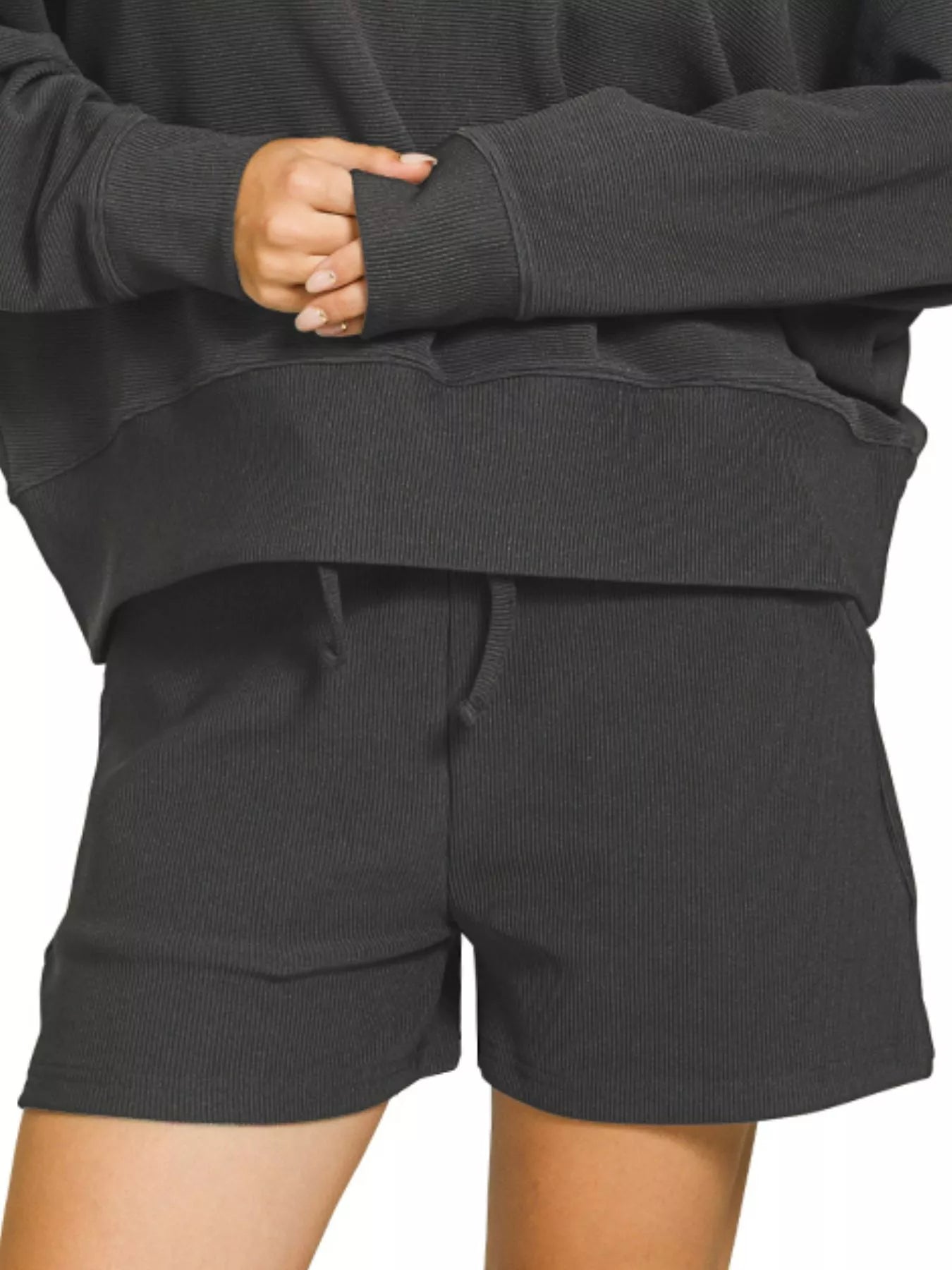 Black Zenana ribbed round neck pullover and shorts set from Trendsi, displayed flat with fabric texture visible.