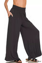 Black Zenana smocked waist wide-leg palazzo pants with flowing fabric and relaxed fit, showcased on a model.
