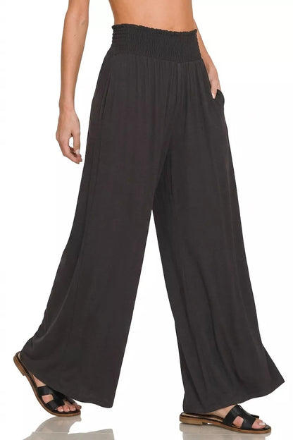 Black Zenana smocked waist wide-leg palazzo pants with flowy fabric and relaxed fit, perfect for casual or stylish wear.