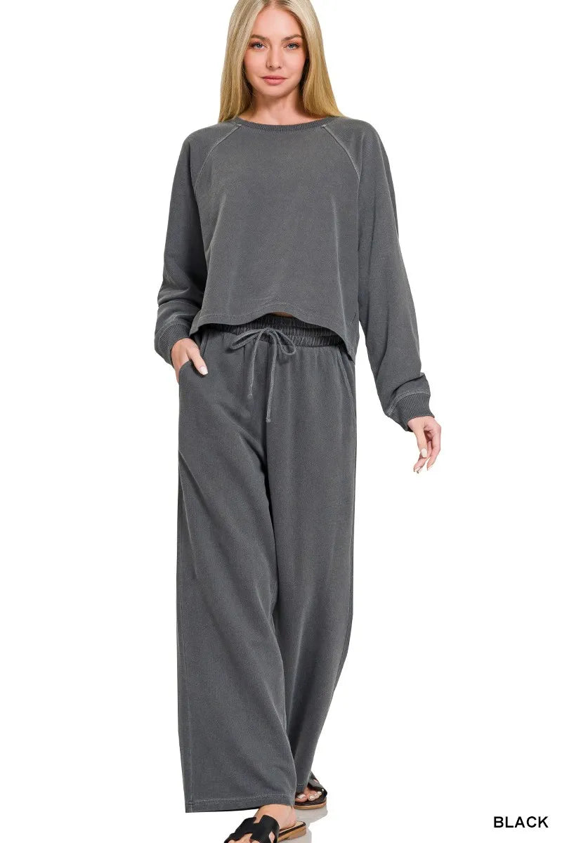 Black Zenana washed fleece round neck pullover and pants set by Trendsi, cozy loungewear with a relaxed fit.