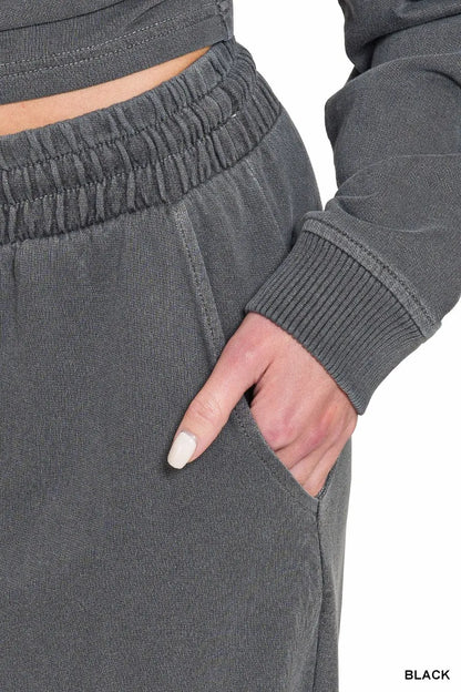 Black Zenana washed fleece pullover and pants set by Trendsi, featuring a round neck and cozy relaxed fit.