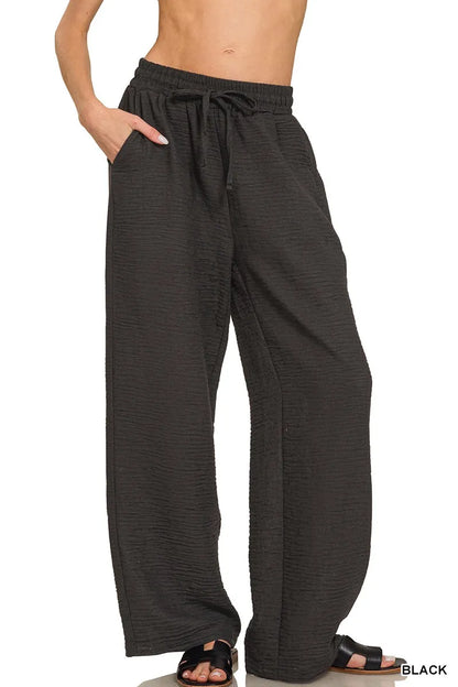 Black Zenana woven crepe elastic band pants with a relaxed fit and comfortable waistband, shown on a model.