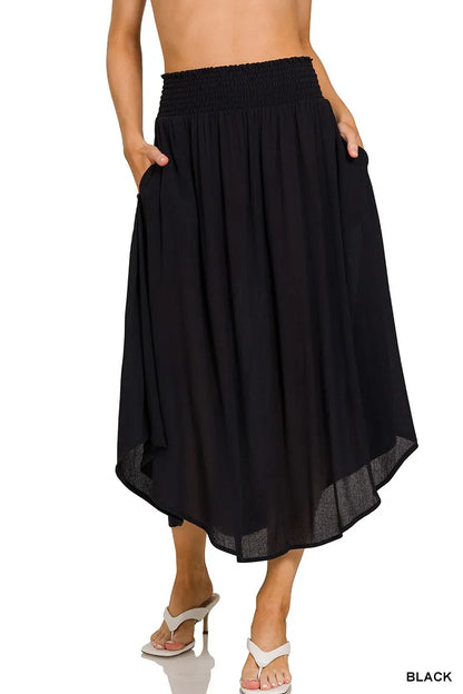 Black Zenana woven crinkle maxi skirt with smocked waist and pockets, featuring a flowing design and comfortable fit.