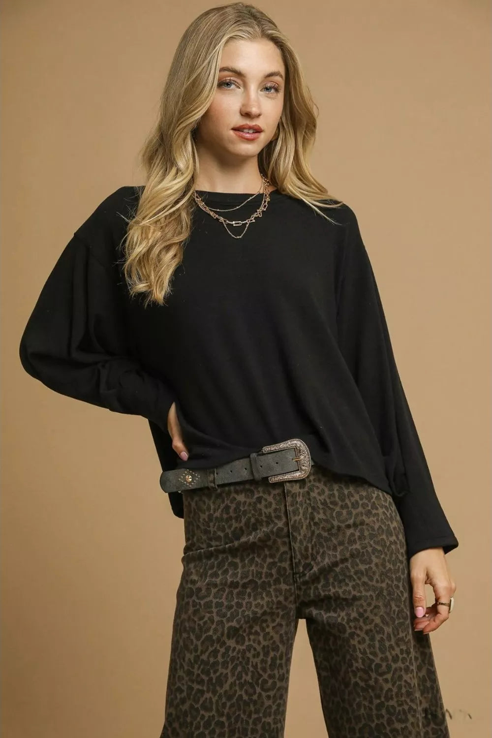 Black Umgee brushed fleece crewneck top with long sleeves, casual and cozy style, displayed in size XS.