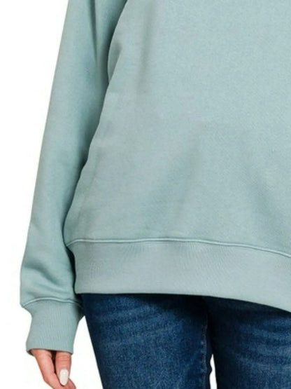 Blue-grey Zenana fleece round neck sweatshirt by Trendsi, showing a cozy, casual fit with long sleeves and ribbed cuffs.