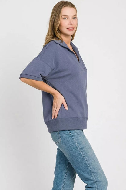 Blue Zenana scuba collared short sleeve pullover from Trendsi, featuring a stylish design and comfortable fit.