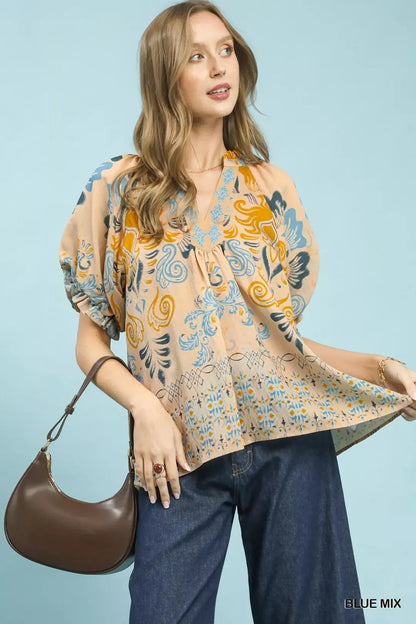 Blue mixed border print puff sleeve V-neck blouse by Umgee, featuring a stylish design and lightweight fabric.