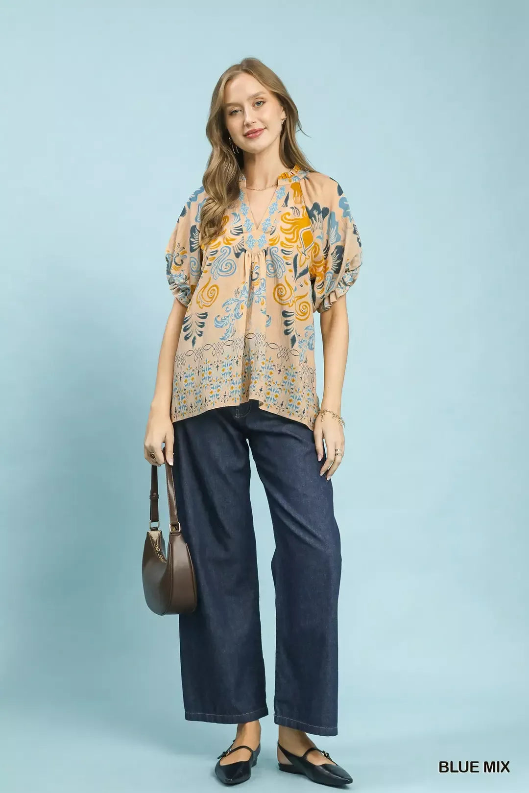 Blue mixed Umgee border print puff sleeve V-neck blouse with relaxed fit and stylish design, perfect for casual wear