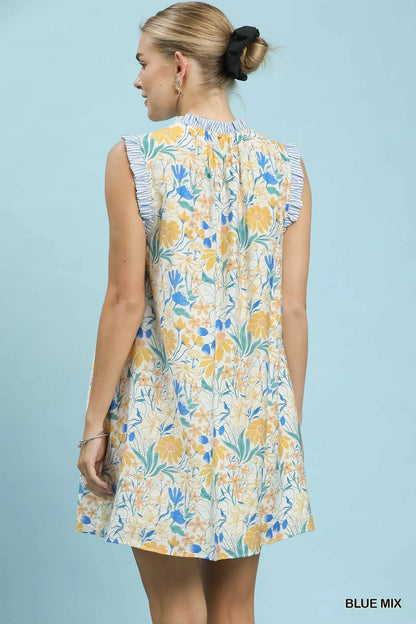 Blue floral print Umgee babydoll dress with long sleeves and flowy silhouette, perfect for casual or summer wear.