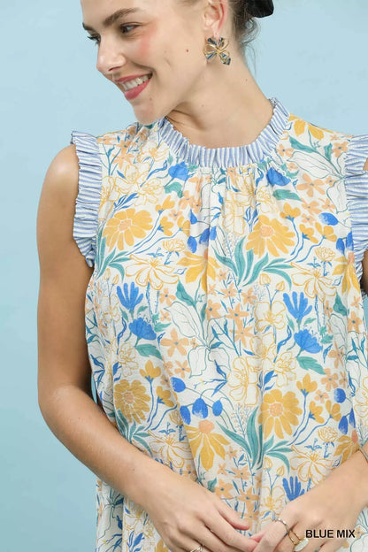 Blue floral print Umgee babydoll dress with a relaxed fit, featuring long sleeves and a feminine, breezy style.
