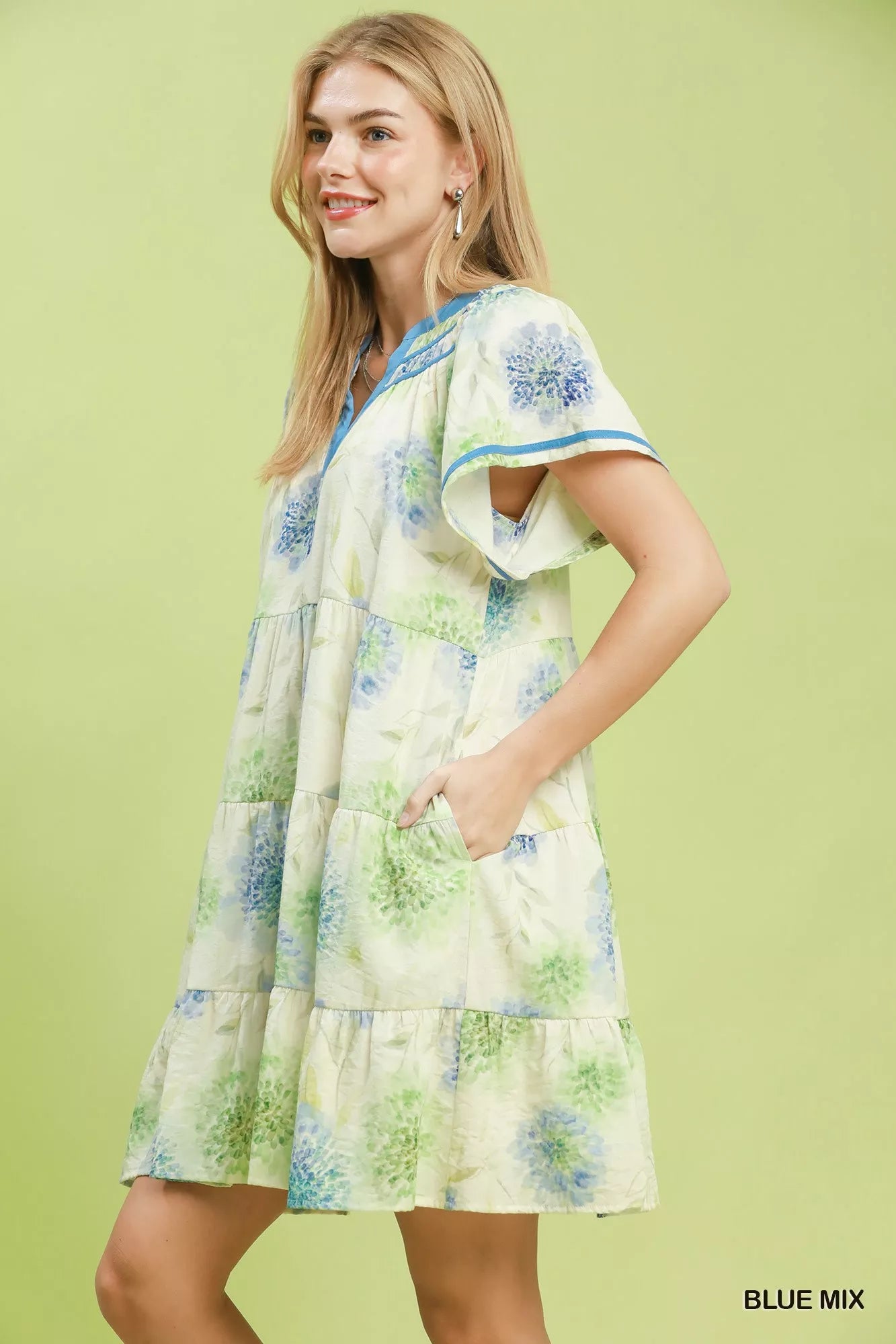 Blue floral print Umgee babydoll dress with contrast trim and tiered design, perfect for a feminine and airy look.