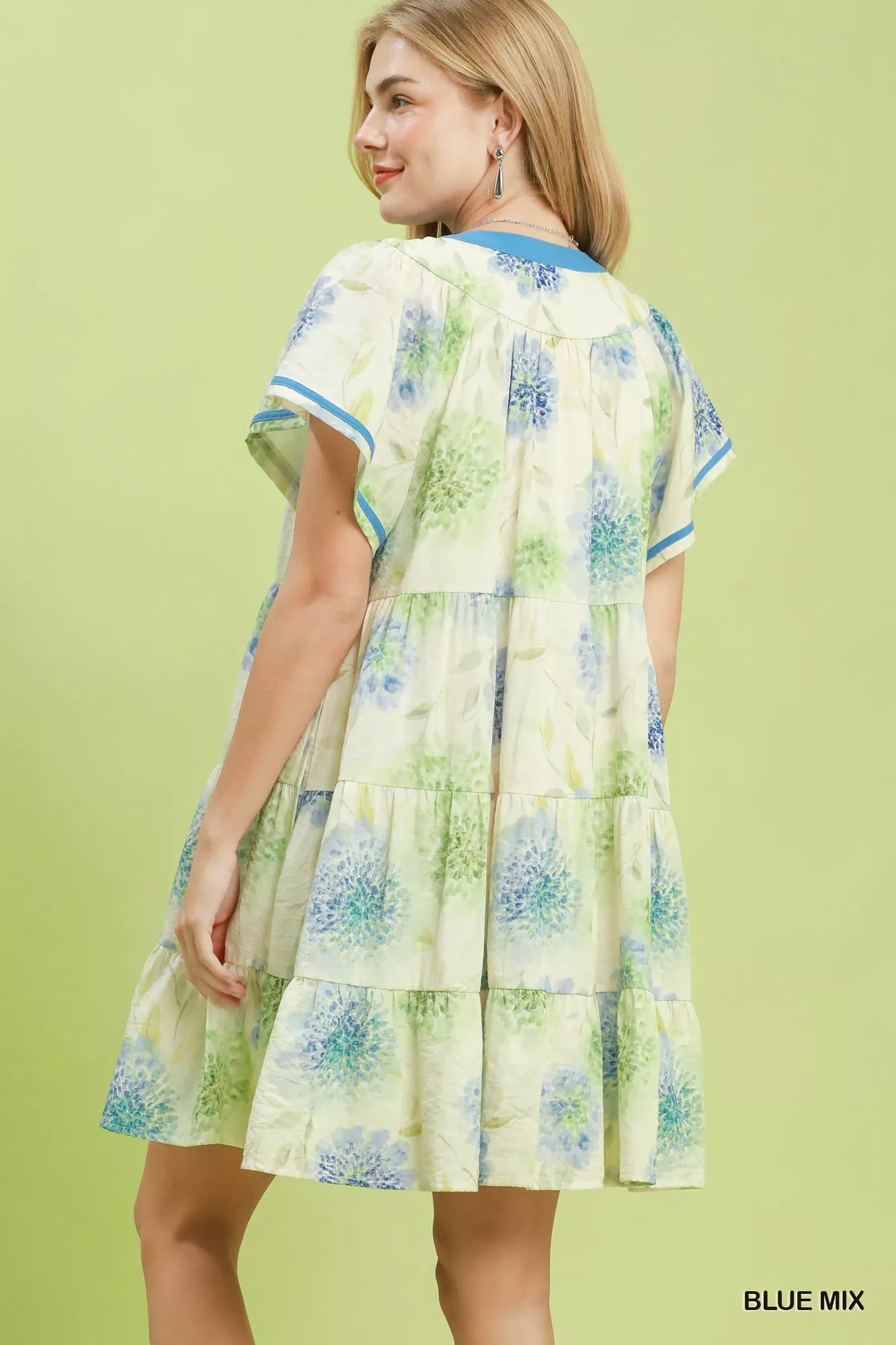 Blue floral print Umgee tiered babydoll dress with contrast trim, featuring a flowy, feminine silhouette and tiered design.