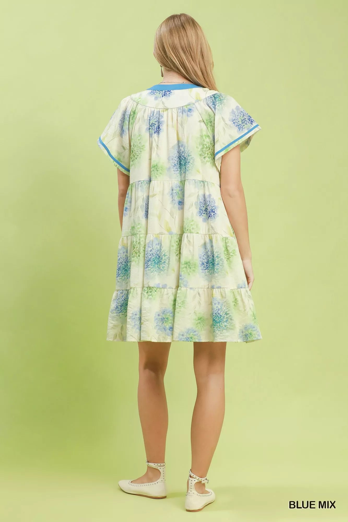 Blue floral print Umgee babydoll dress with contrast trim and tiered design, perfect for casual or summer wear.